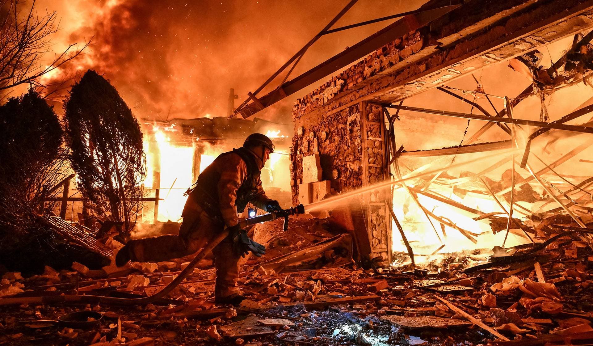 A firefighter works at the site of buildings hit by a Russian drone strike in Zaporizhzhia