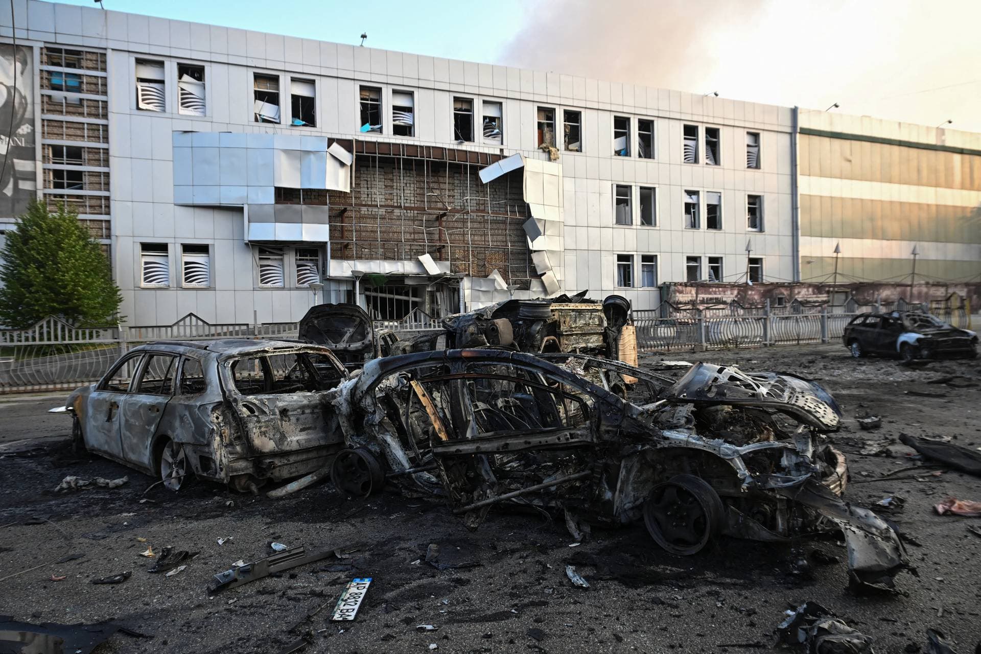 Destroyed cars and a building of shopping mall damaged by a Russian drone strike in Zaporizhzhia