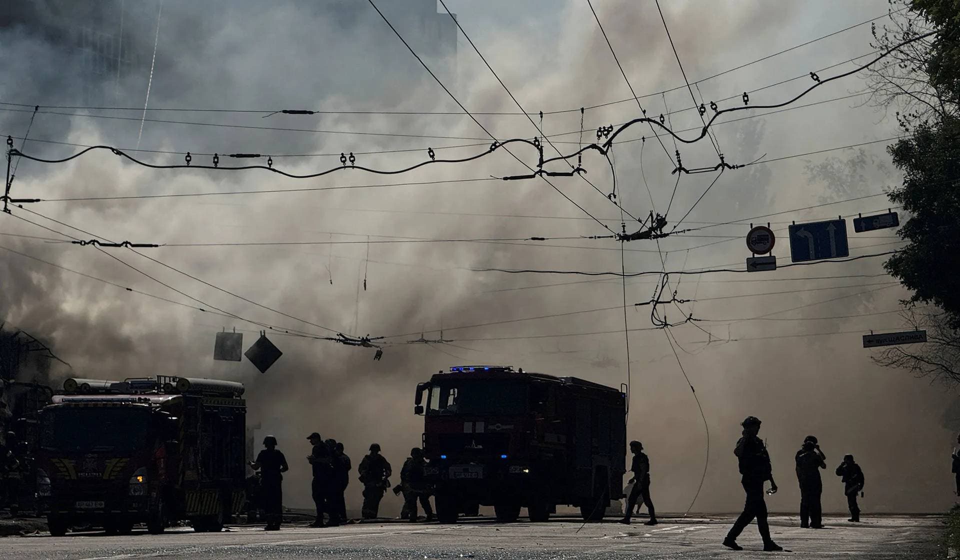 Firefighters work at the site of a Russian missile strike in Zaporizhzhia